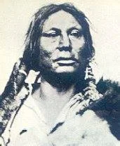 Black-and-white historical portrait of Chief Gall, a Lakota man with long hair, wearing a fur robe over his shoulders.