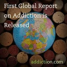 A world globe resting among wine corks, with the text "First Global Report on Addiction is Released" and the addiction.com logo.