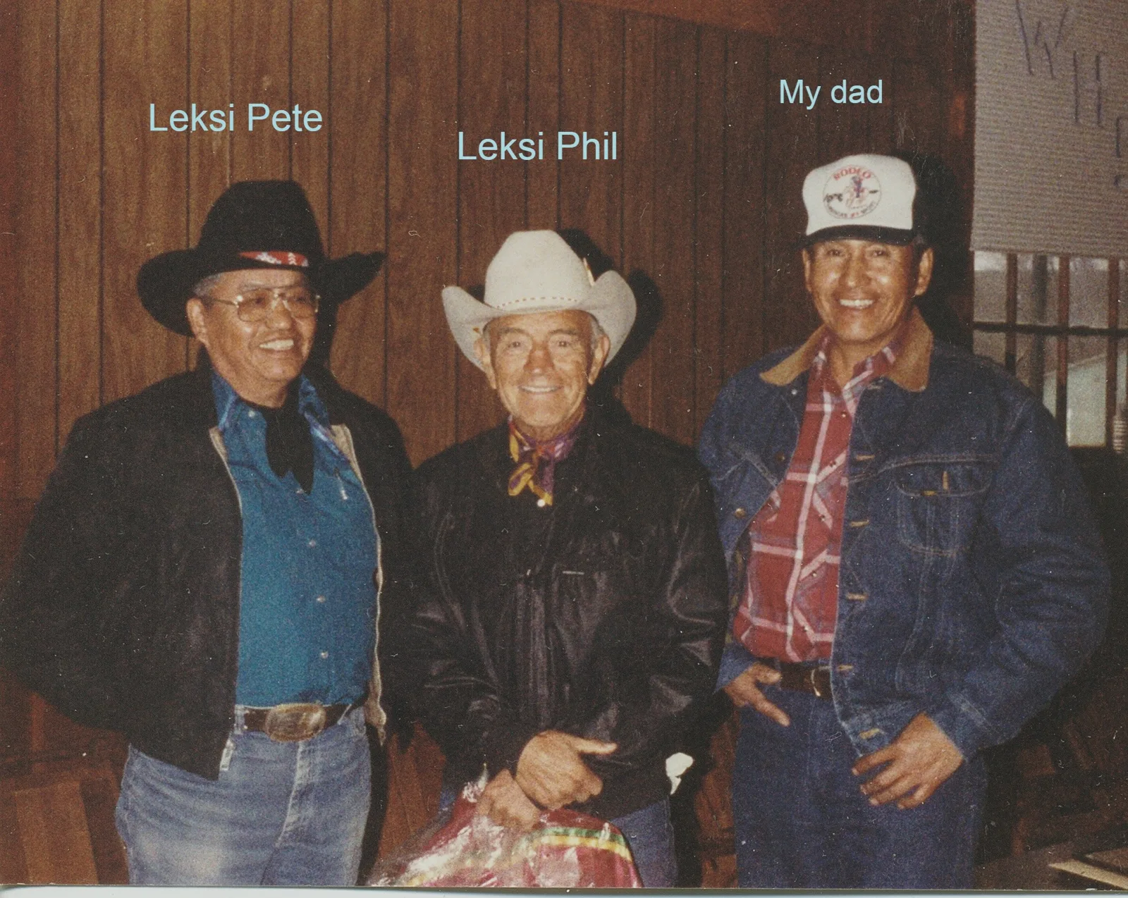 Three smiling men in western wear indoors, labeled Leksi Pete, Leksi Phil and My dad.