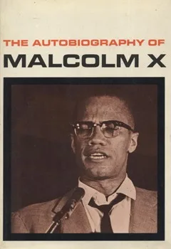 Cover of The Autobiography of Malcolm X, showing a sepia photo of Malcolm X in glasses speaking into a microphone.