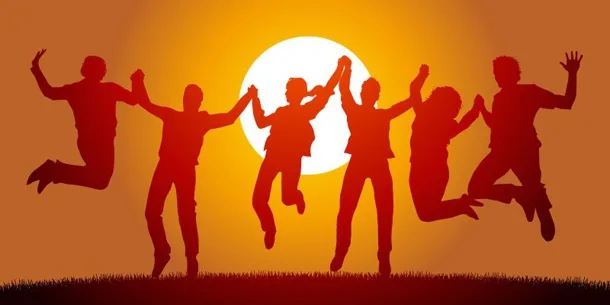 Silhouettes of six young people holding hands and leaping joyfully in front of a large glowing sun against an orange sky.