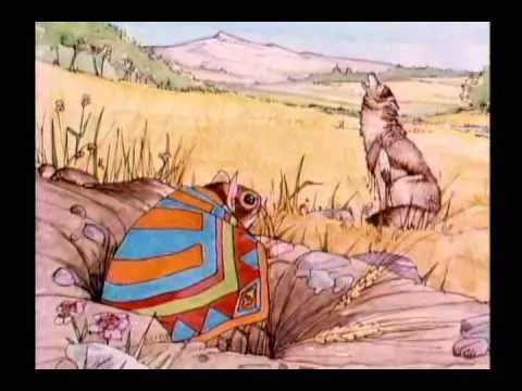 Illustration of a little mouse wrapped in a colorful striped blanket peeking from a rocky burrow, while a wolf howls in a golden grassy field with mountains beyond.