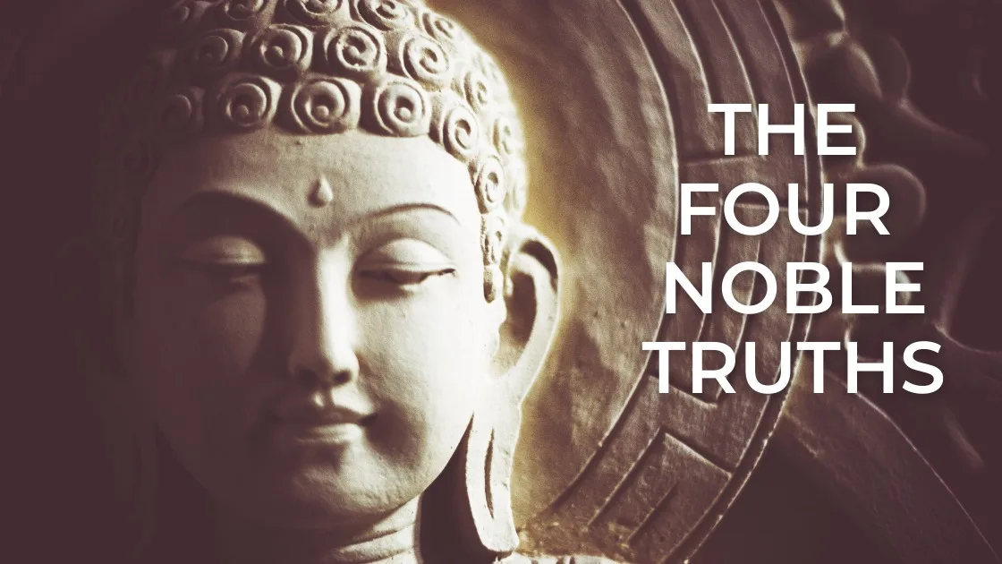 Close-up of a carved stone Buddha head with closed eyes and curled hair, softly lit, beside the words "The Four Noble Truths" in white capital letters.