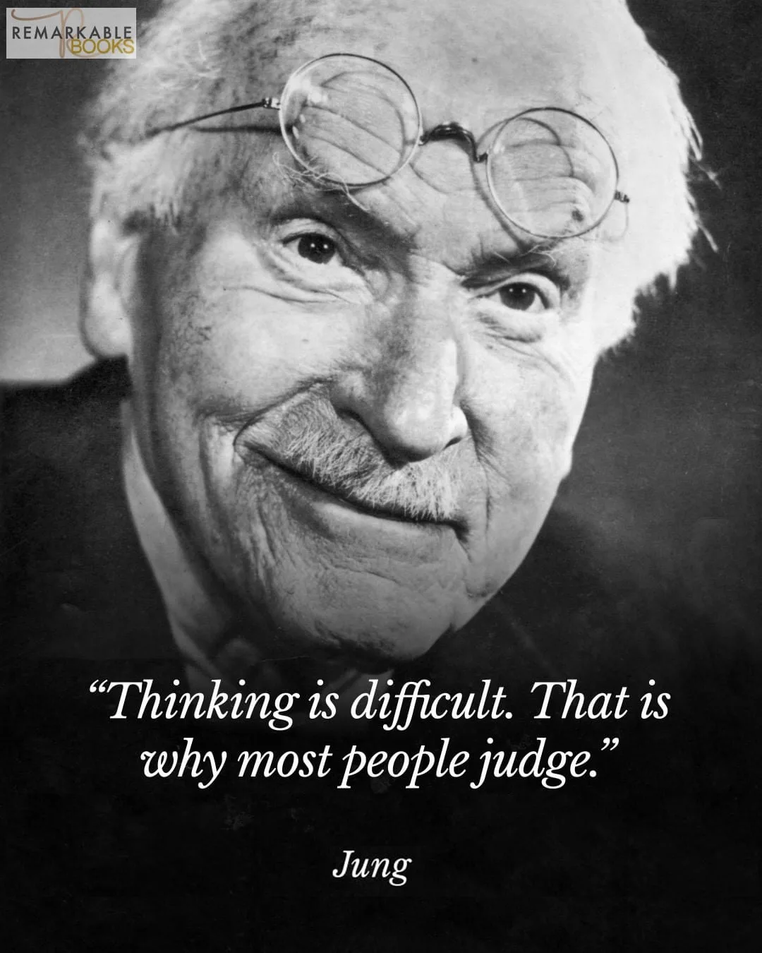 Black-and-white portrait of a smiling elderly man with white hair, a mustache and round glasses pushed up on his forehead, with the quote "Thinking is difficult. That is why most people judge." attributed to Jung.
