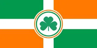Bandera con cuadrantes verdes y naranjas separados por una cruz blanca; en el centro, un círculo blanco con borde verde y naranja que contiene un trébol verde.