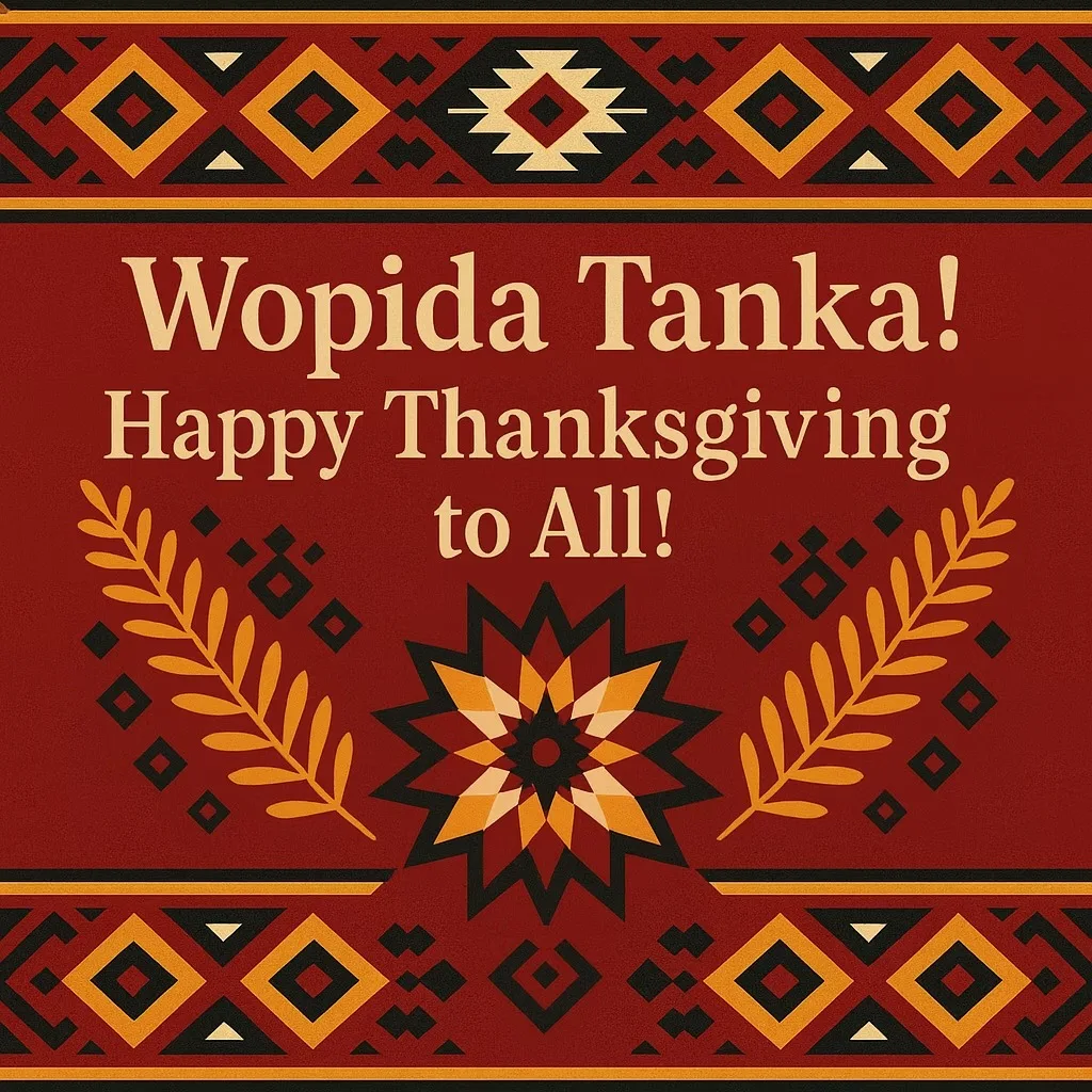 Greeting card with Indigenous geometric patterns in red, gold, black and cream, reading "Wopida Tanka! Happy Thanksgiving to All!" above a star design flanked by golden leaves.